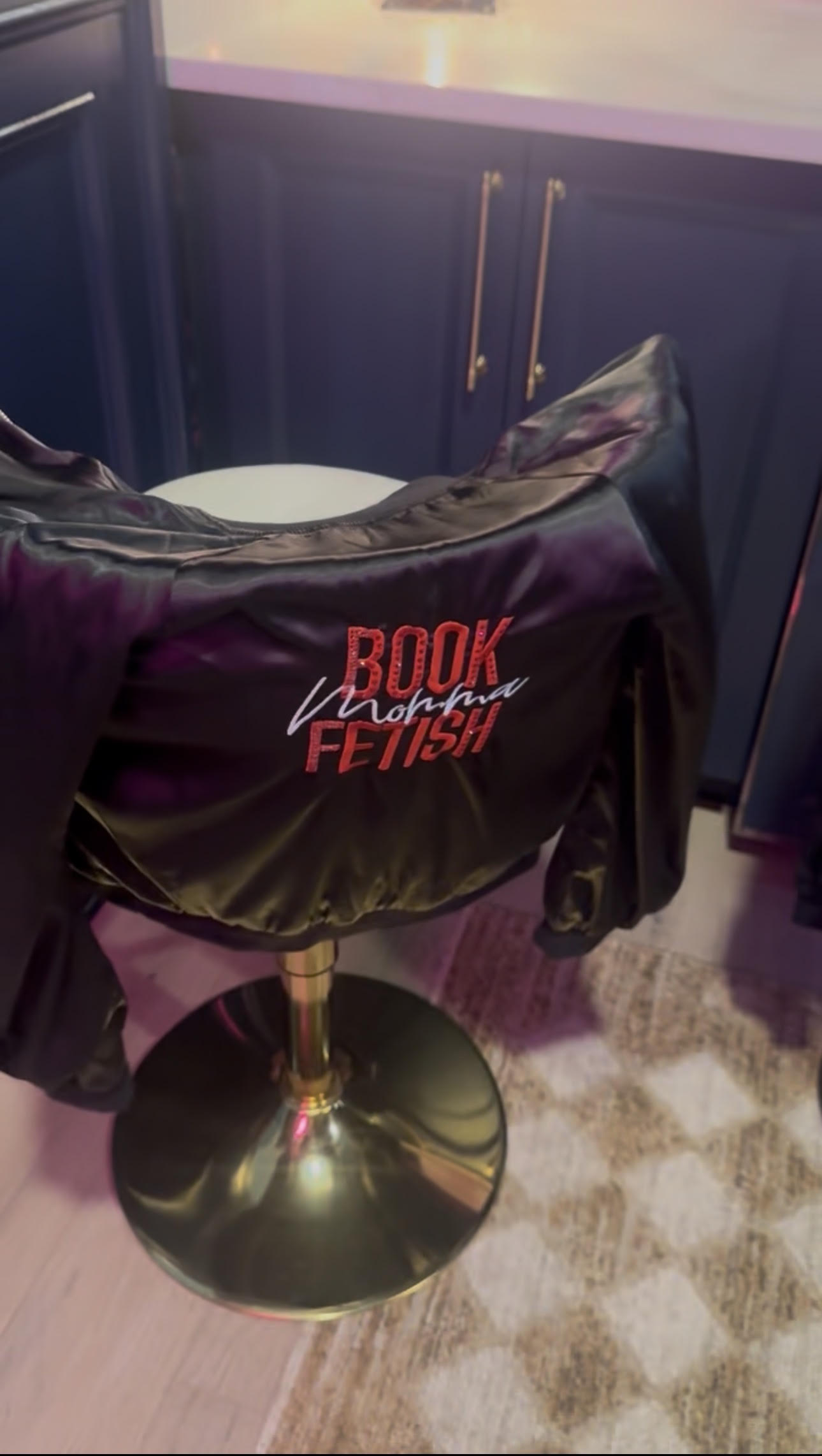 The signature black Book Fetish Momma bomber jacket