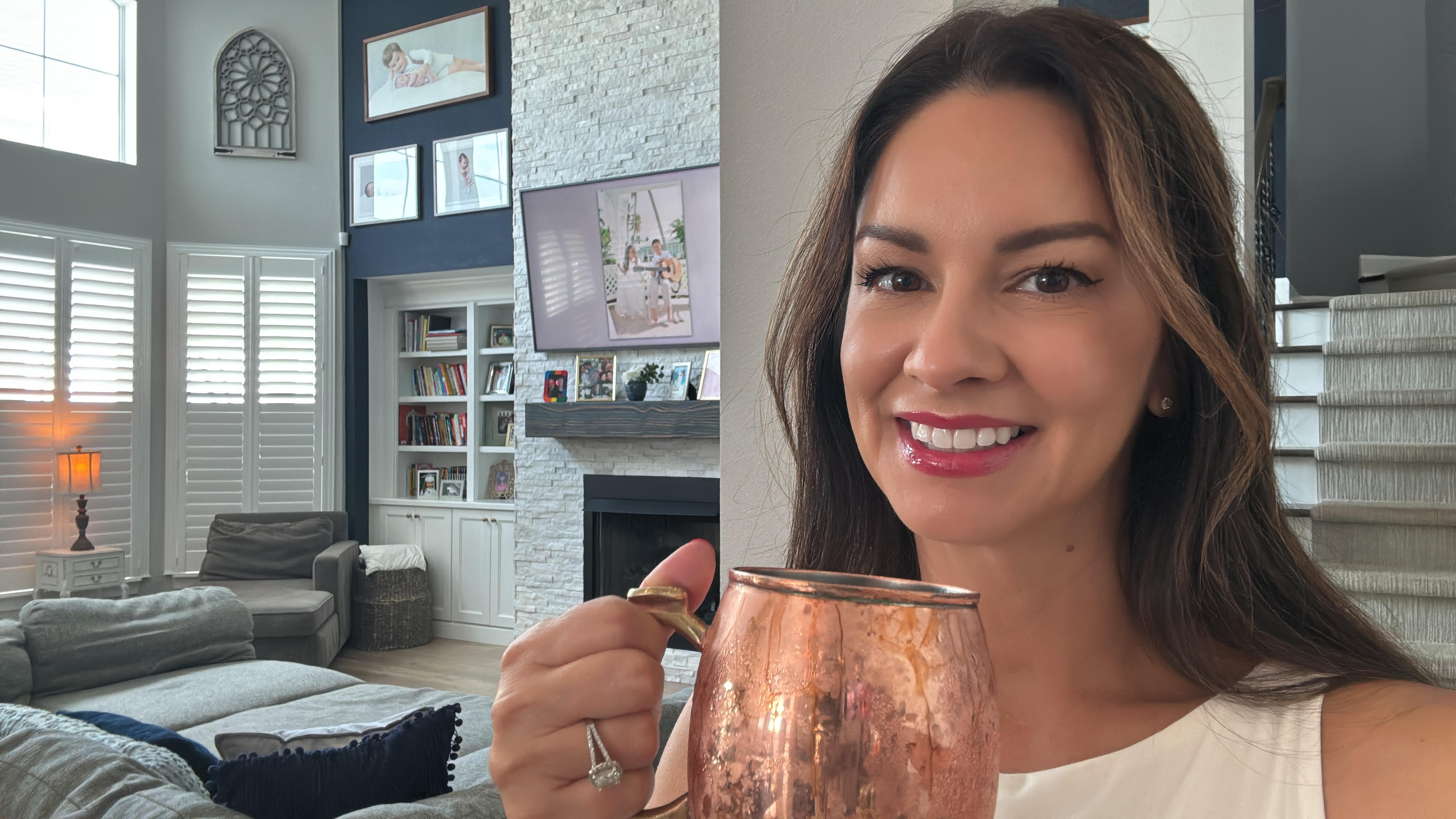 A Book Fetish Momma toasting with a copper mule mug from the Blackberry & Lavender Moscow Mule Bar